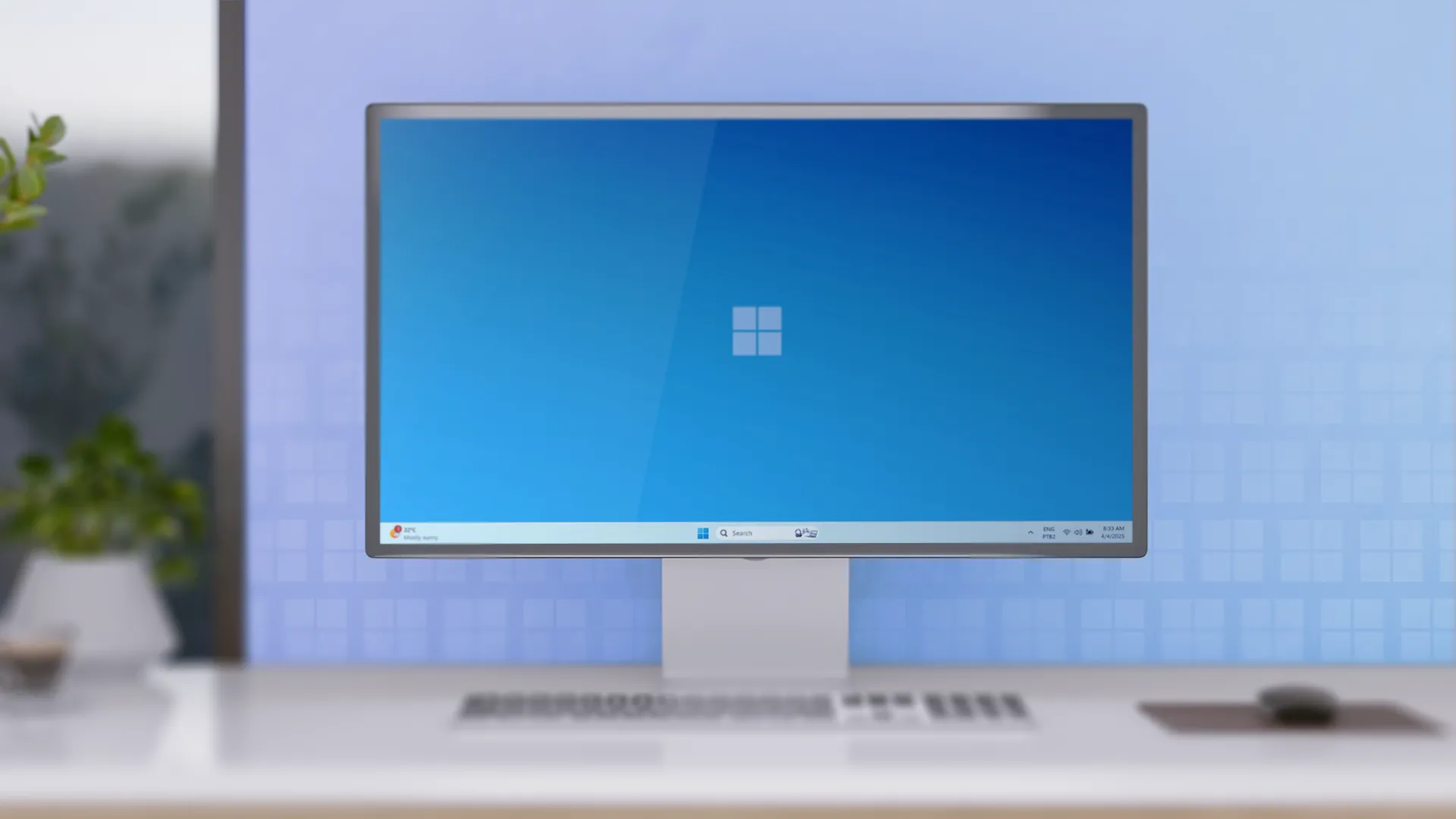 Bàn làm việc tối giản với một máy tính để bàn chạy Windows 11.