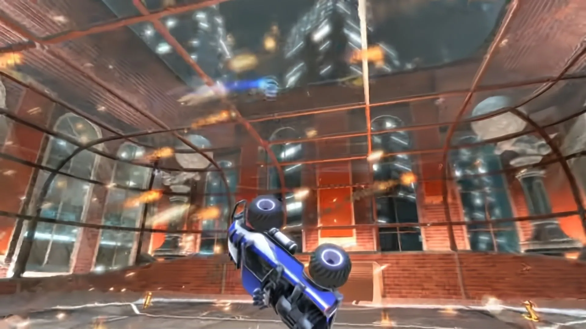 Một chiếc xe tải đang bay lượn trong không khí khi lửa bốc lên xung quanh trong Supersonic Acrobatic Rocket-Powered Battle-Cars.