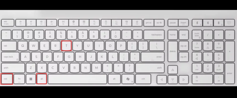Bàn phím màu trắng với các ô màu đỏ làm nổi bật các phím Ctrl, Alt và T để mở Terminal trên Ubuntu.