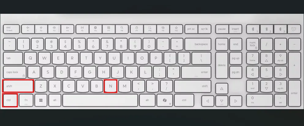 Bàn phím màu trắng với các ô màu đỏ làm nổi bật các phím Ctrl, Shift và N để tạo thư mục mới trên Ubuntu.