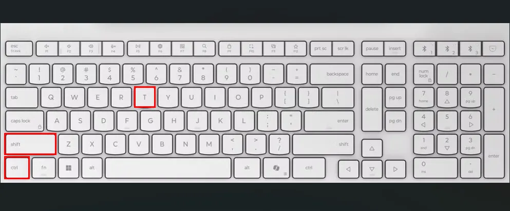 Bàn phím màu trắng với các ô màu đỏ làm nổi bật các phím Ctrl, Shift và T để mở tab Terminal mới trên Ubuntu.