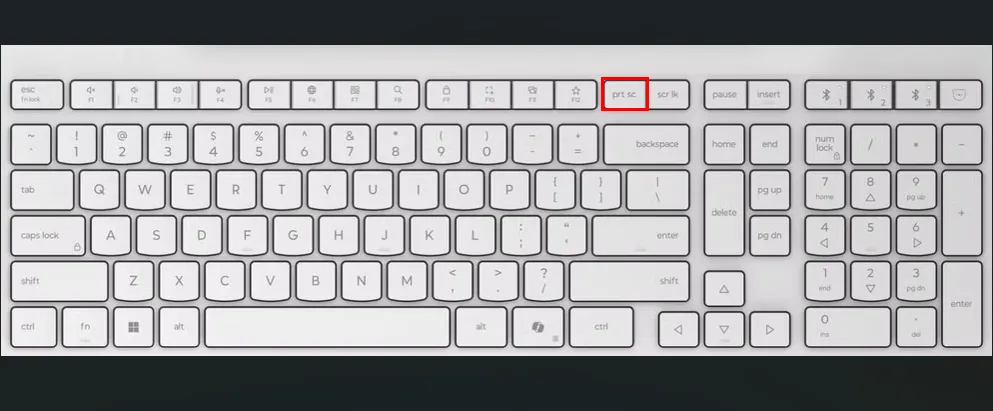 Bàn phím màu trắng với các ô màu đỏ làm nổi bật phím PrtSc để chụp màn hình trên Ubuntu.