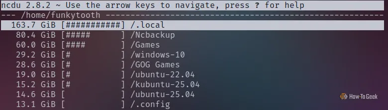 Kết quả quét ncdu trên Terminal Linux cho thấy các thư mục game lớn và thư mục .local, minh họa dung lượng bị chiếm bởi trò chơi ít dùng.