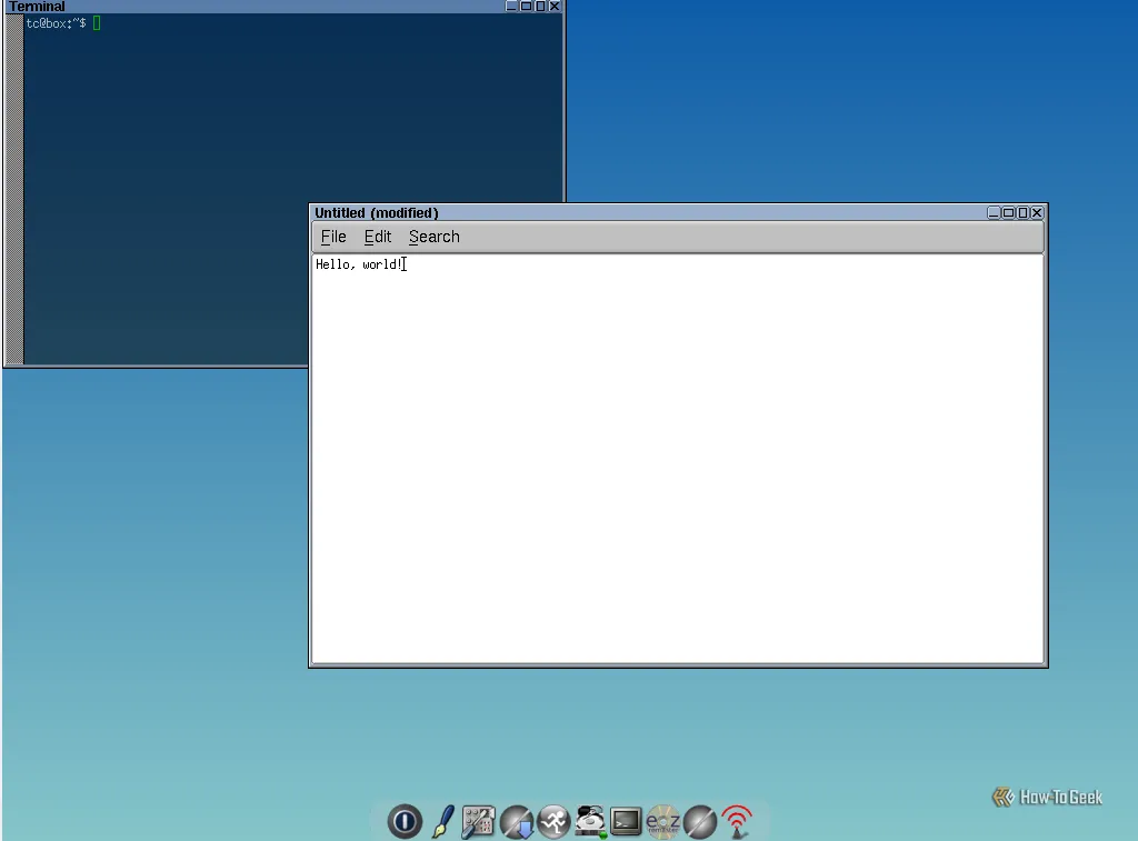 Màn hình cài đặt TinyCore Linux với một cửa sổ terminal và ứng dụng ghi chú, thể hiện sự tối giản và kích thước nhỏ gọn của distro này.