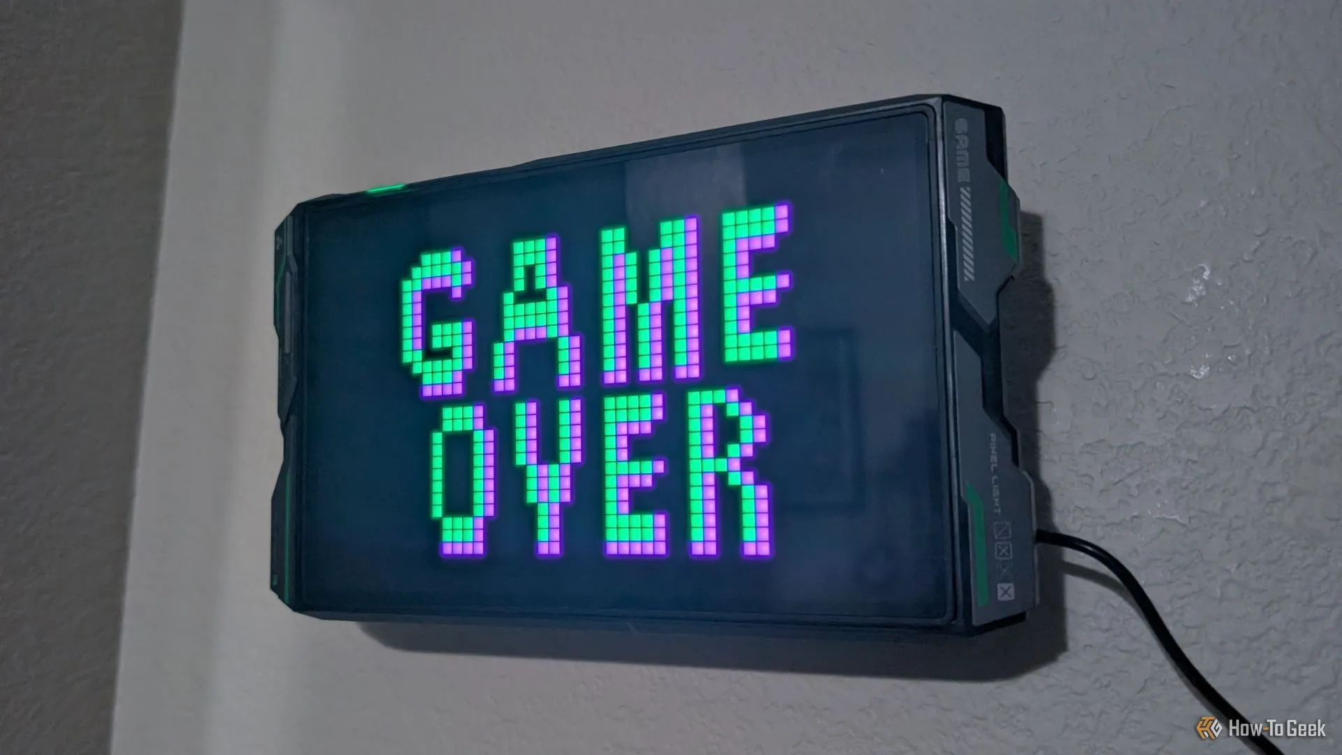 Màn hình đèn Govee Gaming Pixel Light hiển thị chữ &quot;Game Over&quot;, báo hiệu game gacha sắp ngừng dịch vụ
