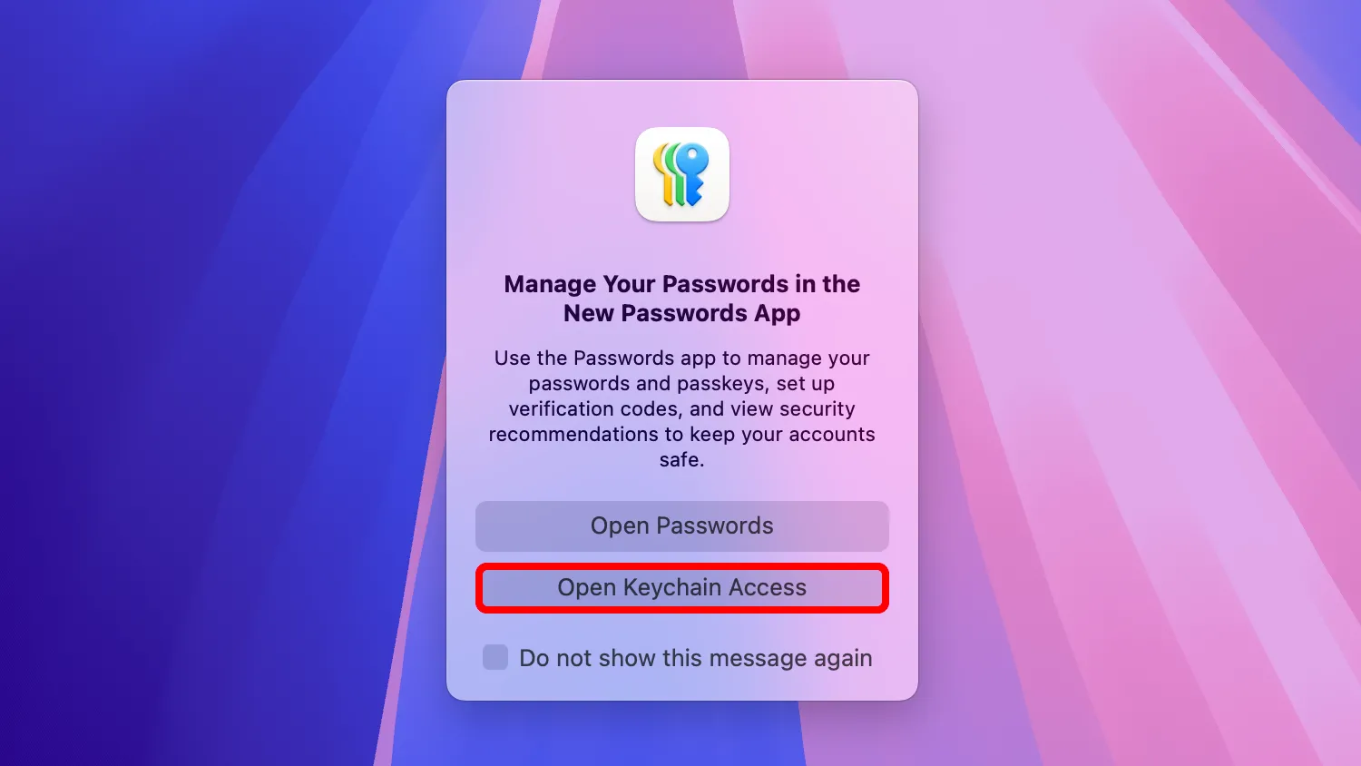 Màn hình nền macOS hiển thị một lời nhắc hỏi có nên mở ứng dụng Passwords hay Keychain Access.