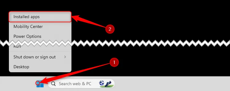 Menu chuột phải của Windows 11 được mở rộng từ biểu tượng Windows trên thanh tác vụ, với tùy chọn 'Installed Apps' (Ứng dụng đã cài đặt) được chọn